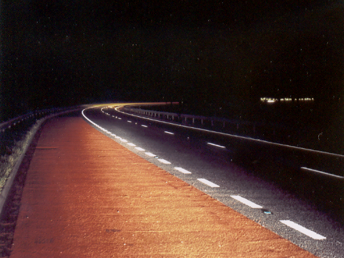 Prismo® Rainline® profiled hot applied thermoplastic applied on road bend as dashed white lines.