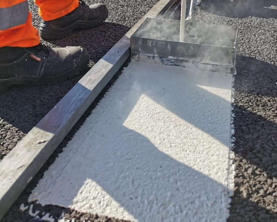 Prismo hot applied thermoplastic screed application for road markings