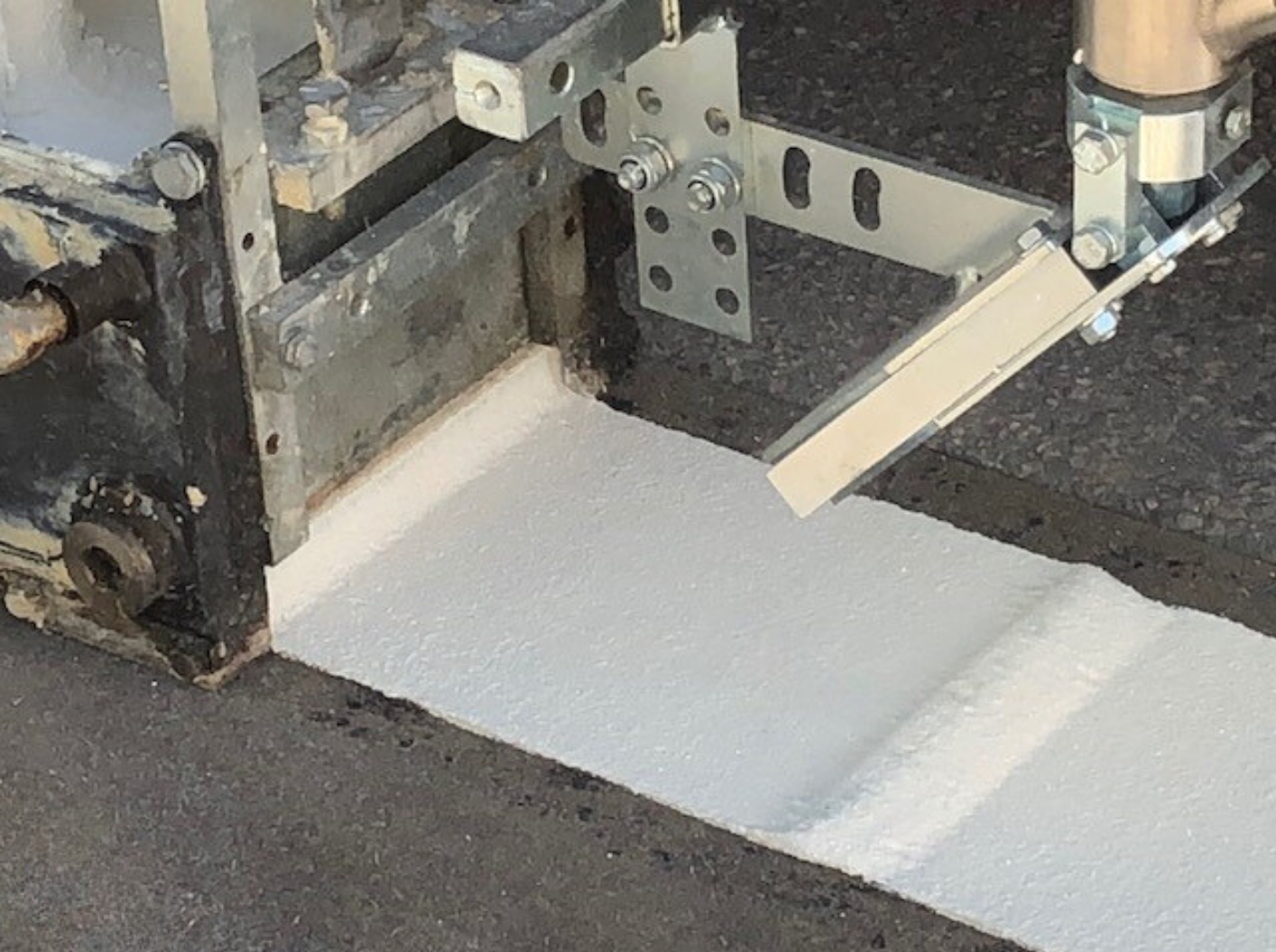 Close-up of Prismo® Vibraline® profiled hot applied thermoplastic being applied using suitable machinery.