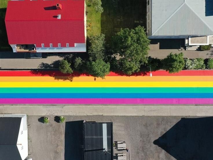 Overhead view of Prismo MMA Vernisol Robur Grip Rainbow Street markings in Husavik, Iceland