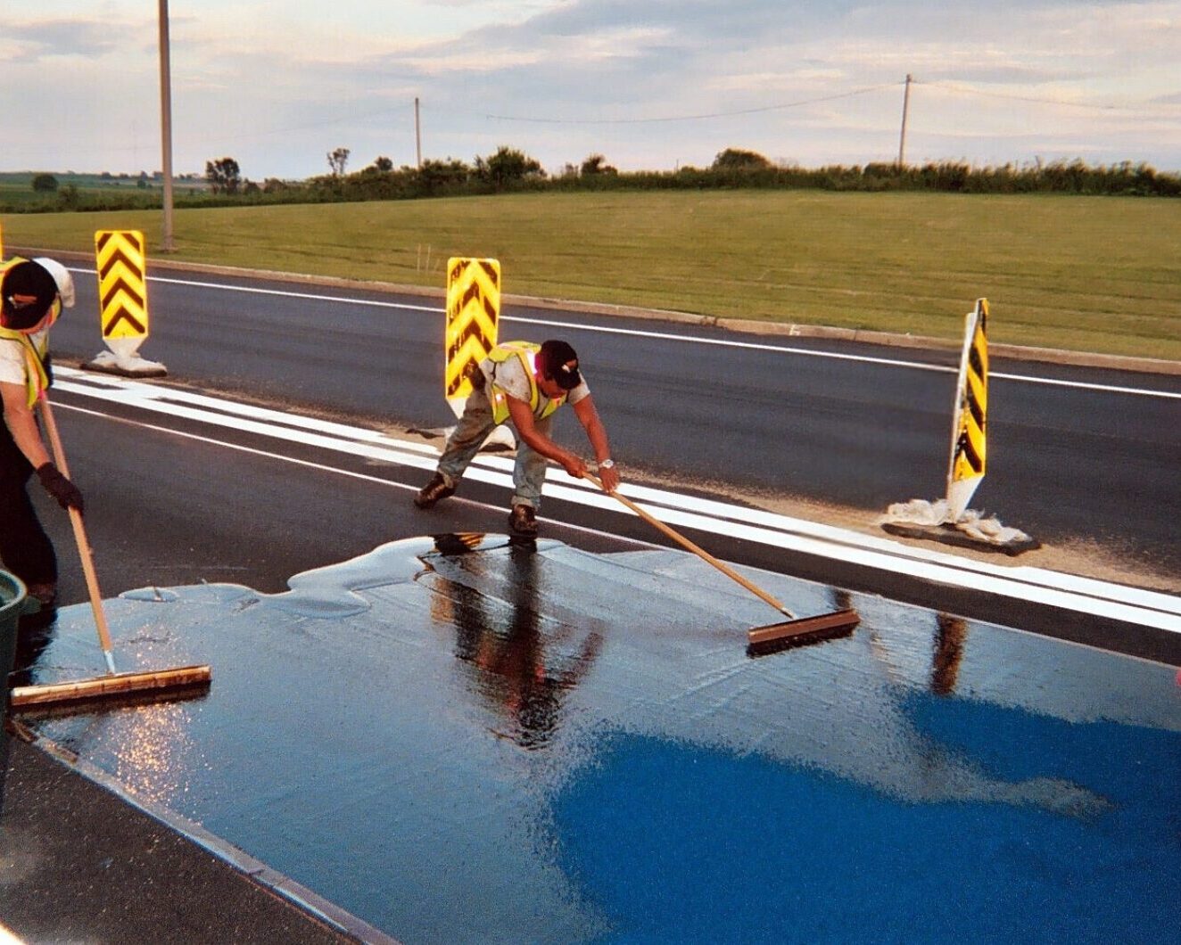 Prismo High Friction Surfacing Tyregrip blue being applied to a road surface