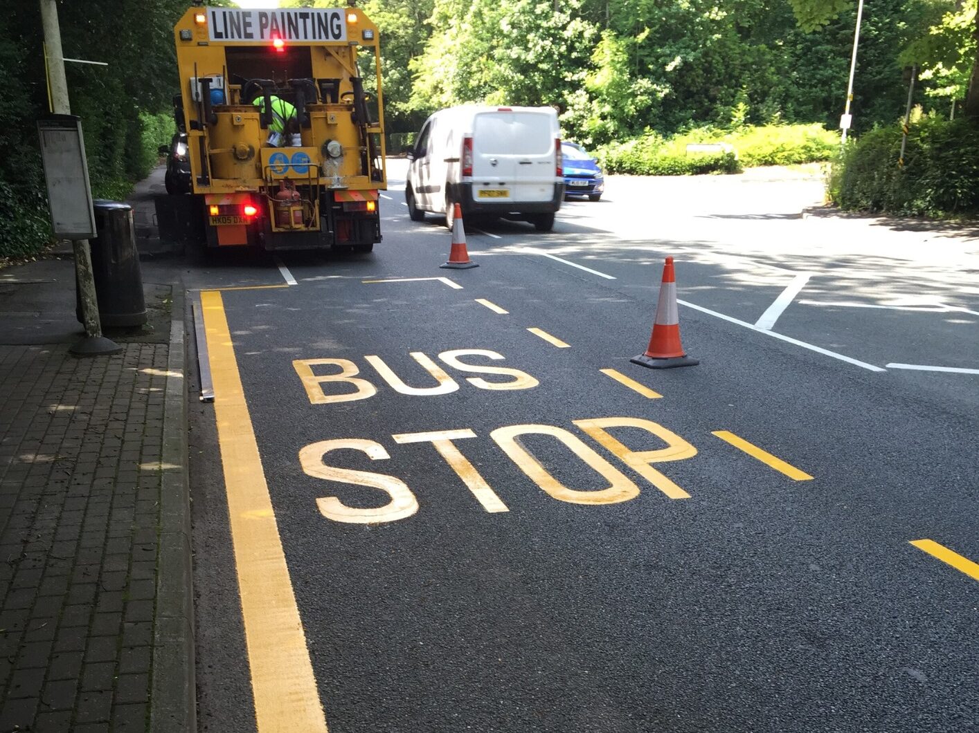 Prismo® Guidemaster® yellow line marking and bus stop writing at bus stop in Bolton.