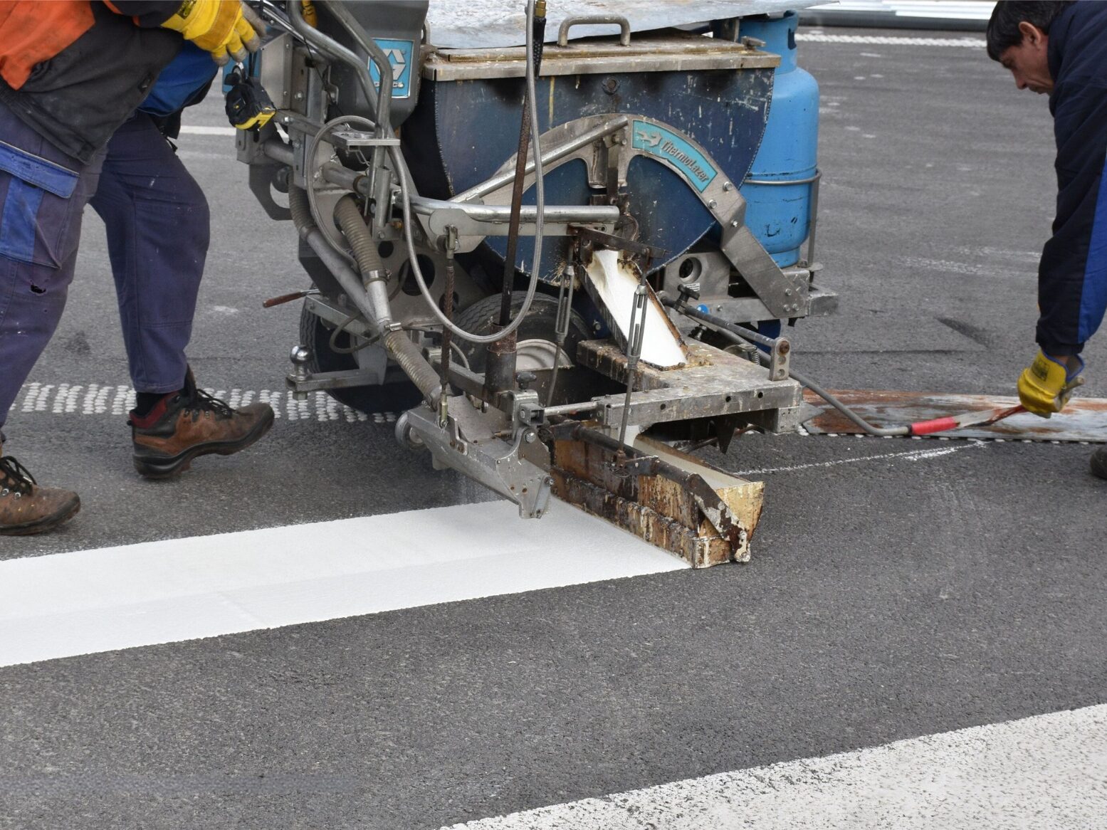 Close-up of Prismo® Lifeline® hot applied thermoplastic applied on road surface using suitable machinery.