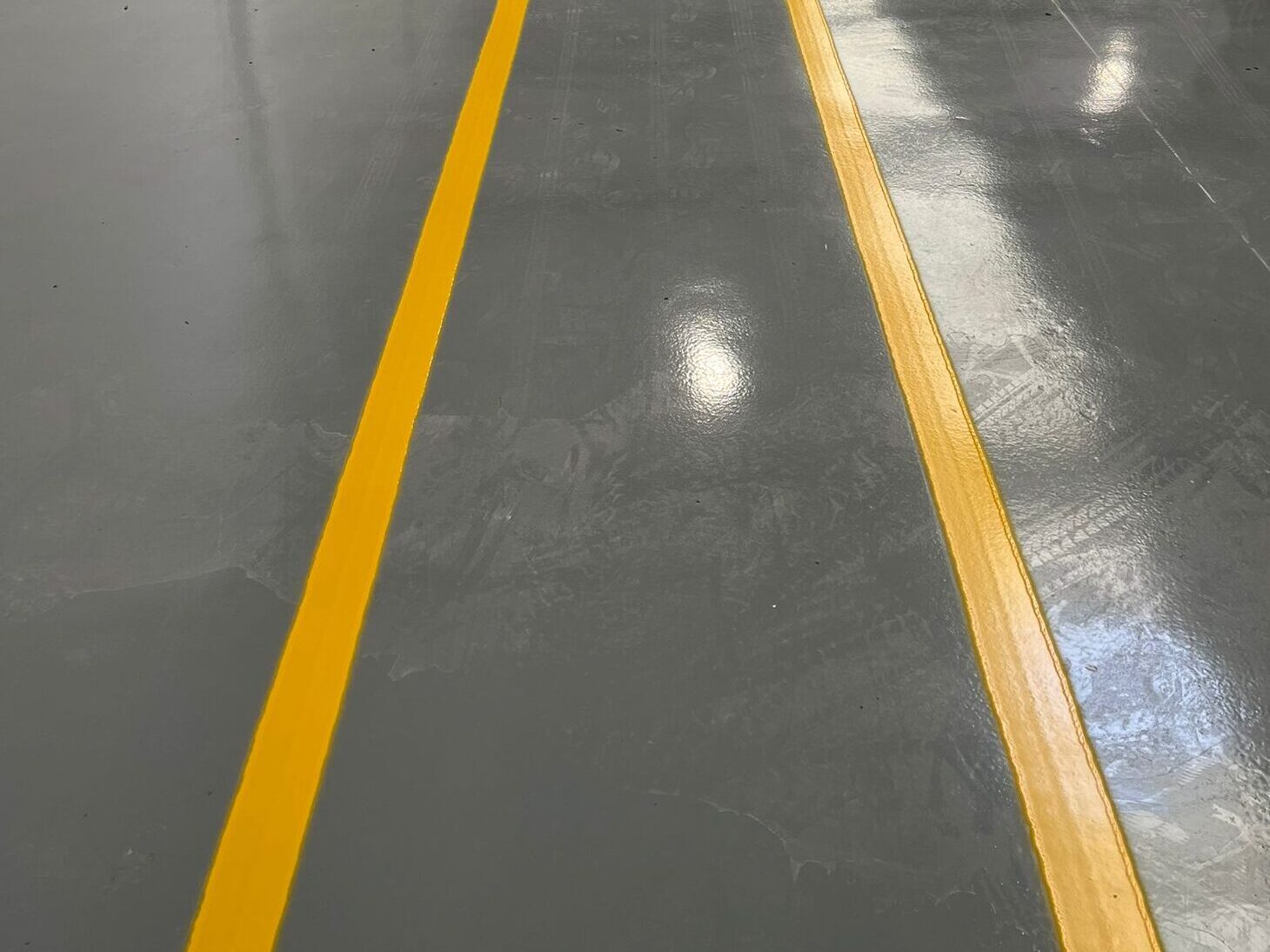 Prismo Epoxyline indoor flooring with yellow line markings for safety and organisation