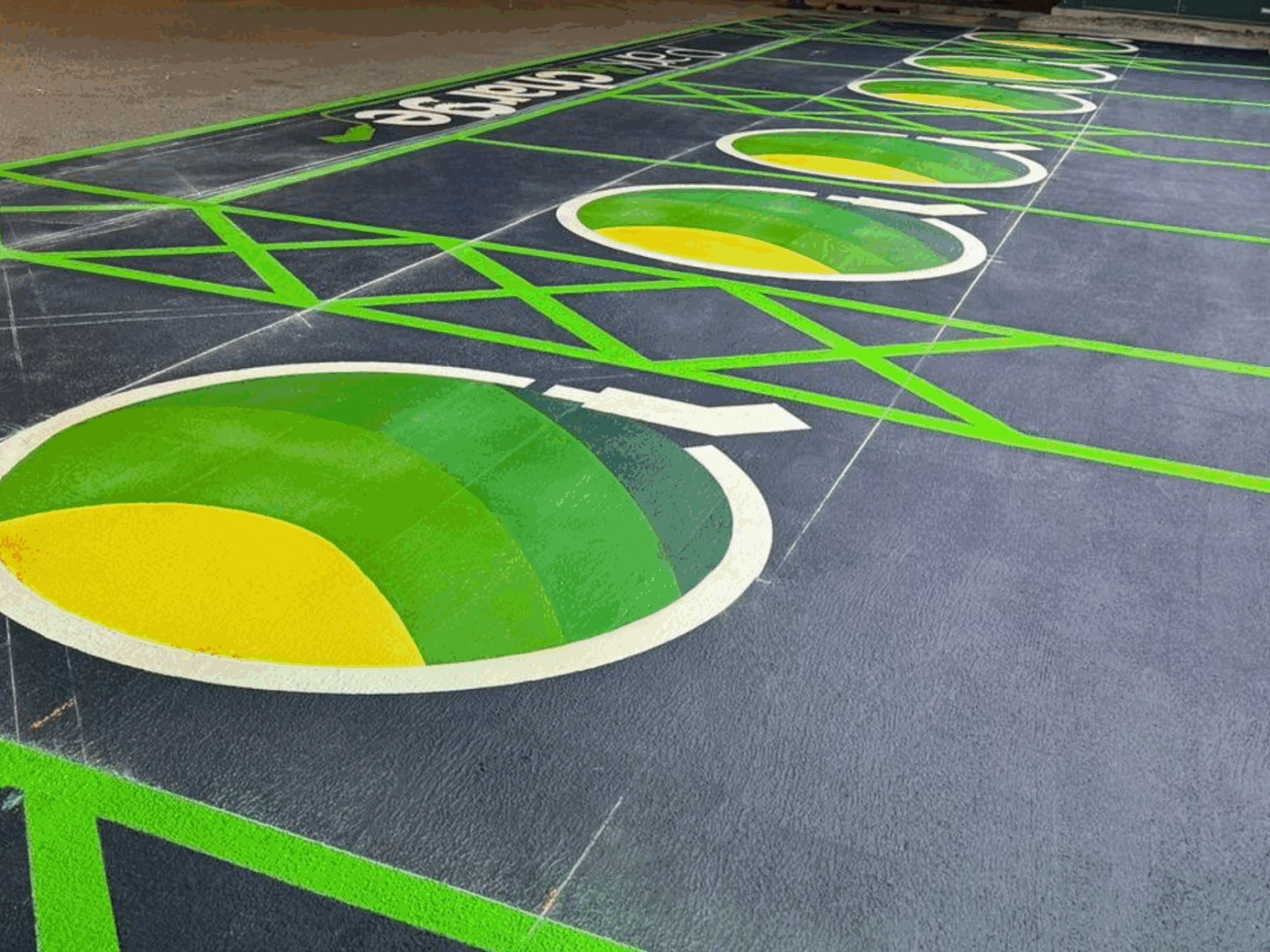 Close-up of Prismo Vernisol MMA and Preformed Thermoplastic markings for EV bays and park & charge areas