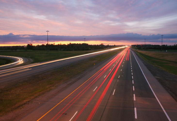 motorway-at-sunset-with-light-trails