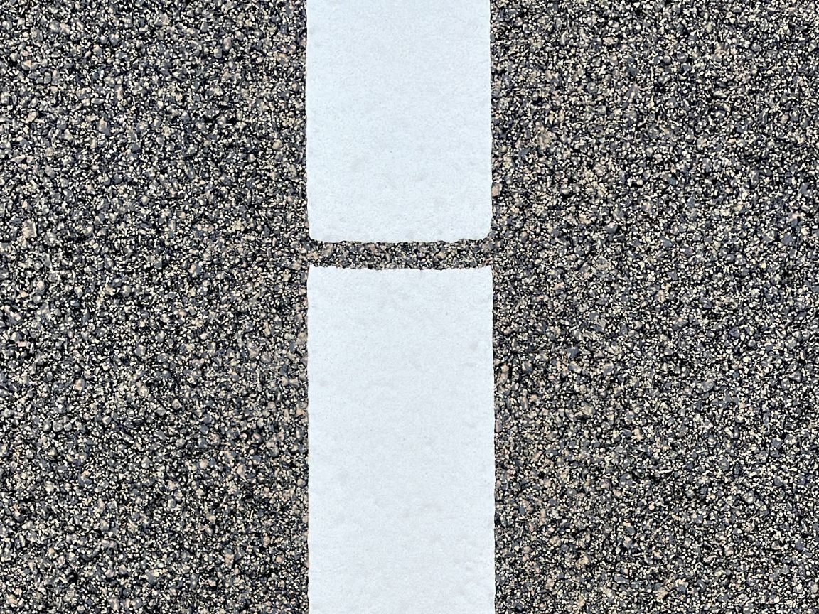 Close-up of Prismo Crystalex NL3 White hot applied thermoplastic road marking in the Netherlands