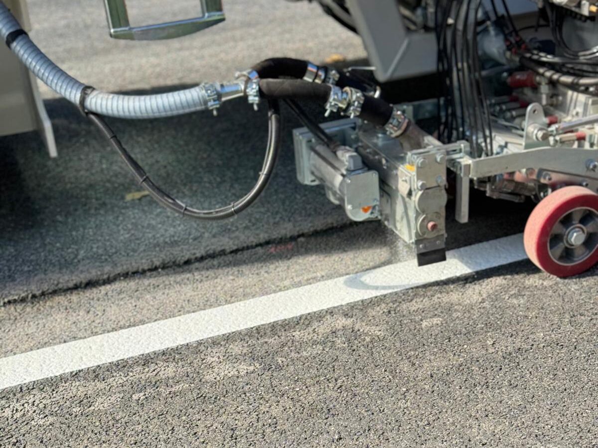 Prismo Duraflect White hot applied thermoplastic line marking being applied in Baden-Württemberg, Germany