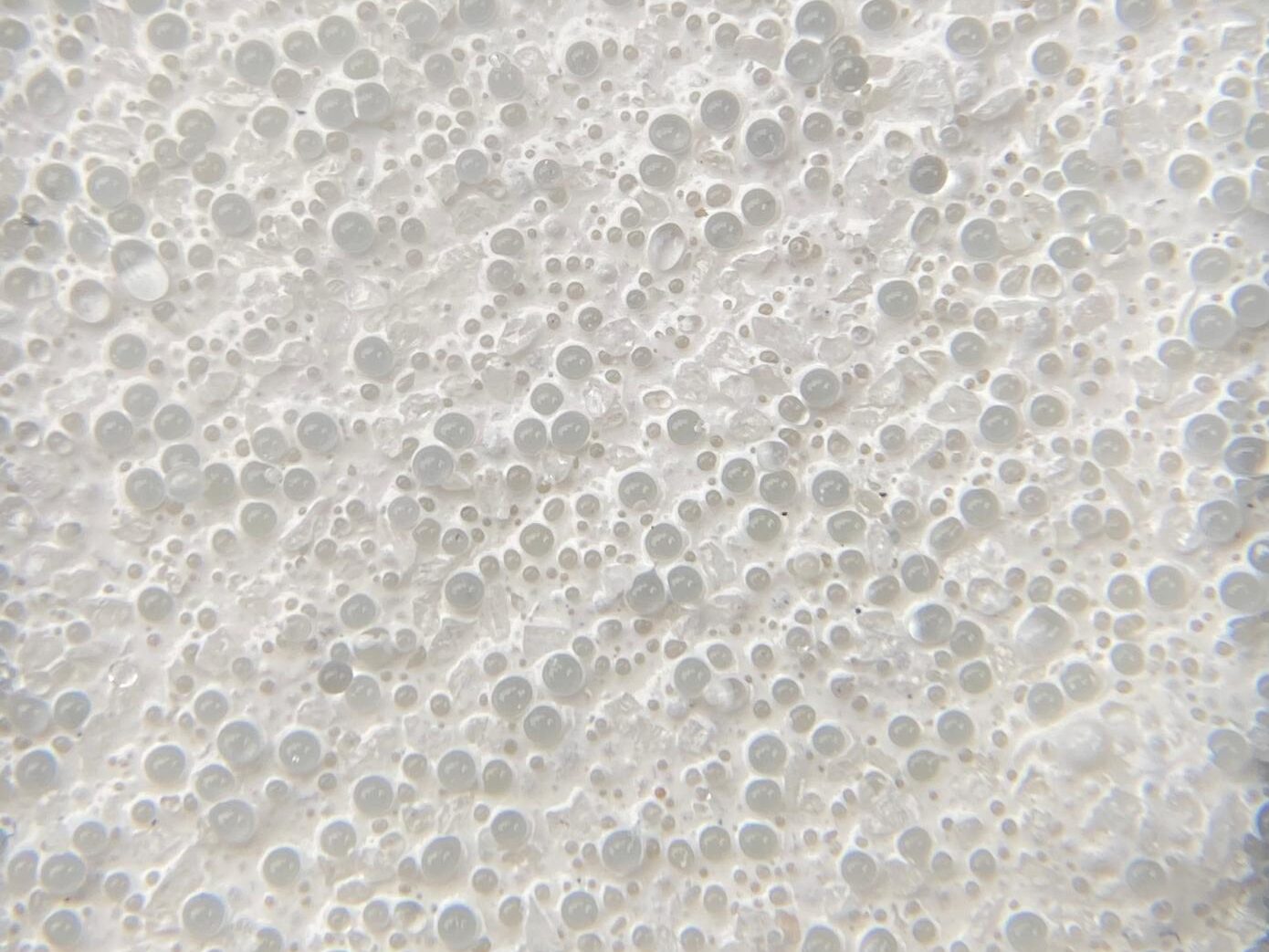 Prismo Duraflect White hot applied thermoplastic road marking with glass beads close-up in Munich, Germany