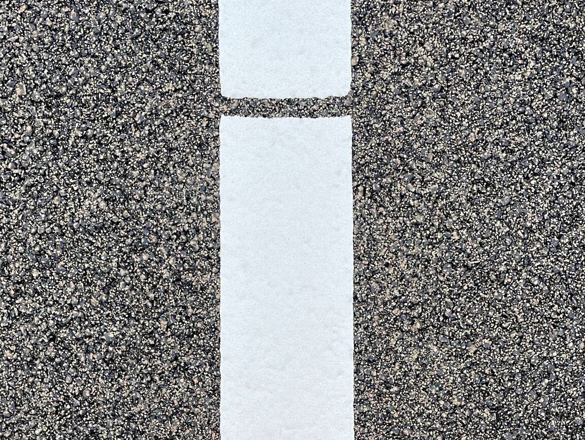 Prismo Prismolux 200 SKR White hot applied thermoplastic road marking close-up in the Netherlands.