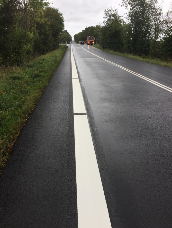 Prismolux Moisture Proof hot applied thermoplastic road marking applied on wet road surface.