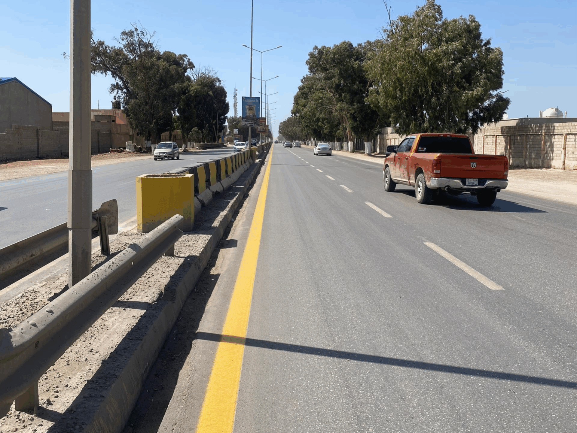 Prismo Sunline hot applied thermoplastic yellow road marking on a street in Libya.