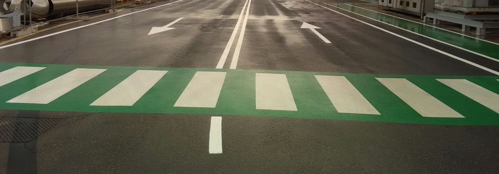 Close-up of Prismo Vernisol Epoline antiskid surface on a pedestrian crossing