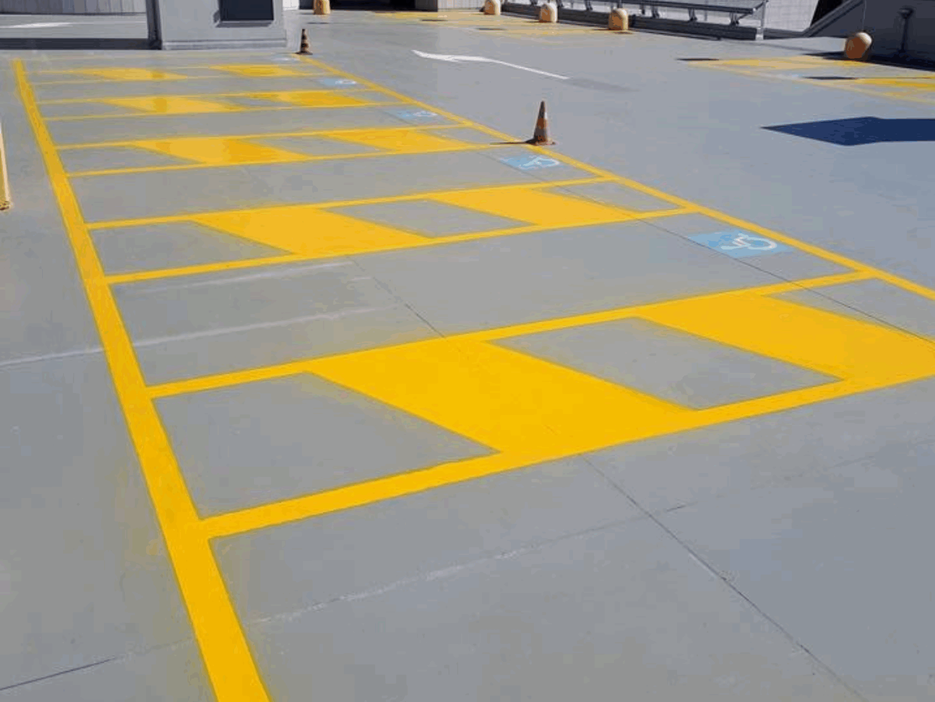Prismo Vernisol Polisol flooring paint applied in yellow for disabled bays in a car park