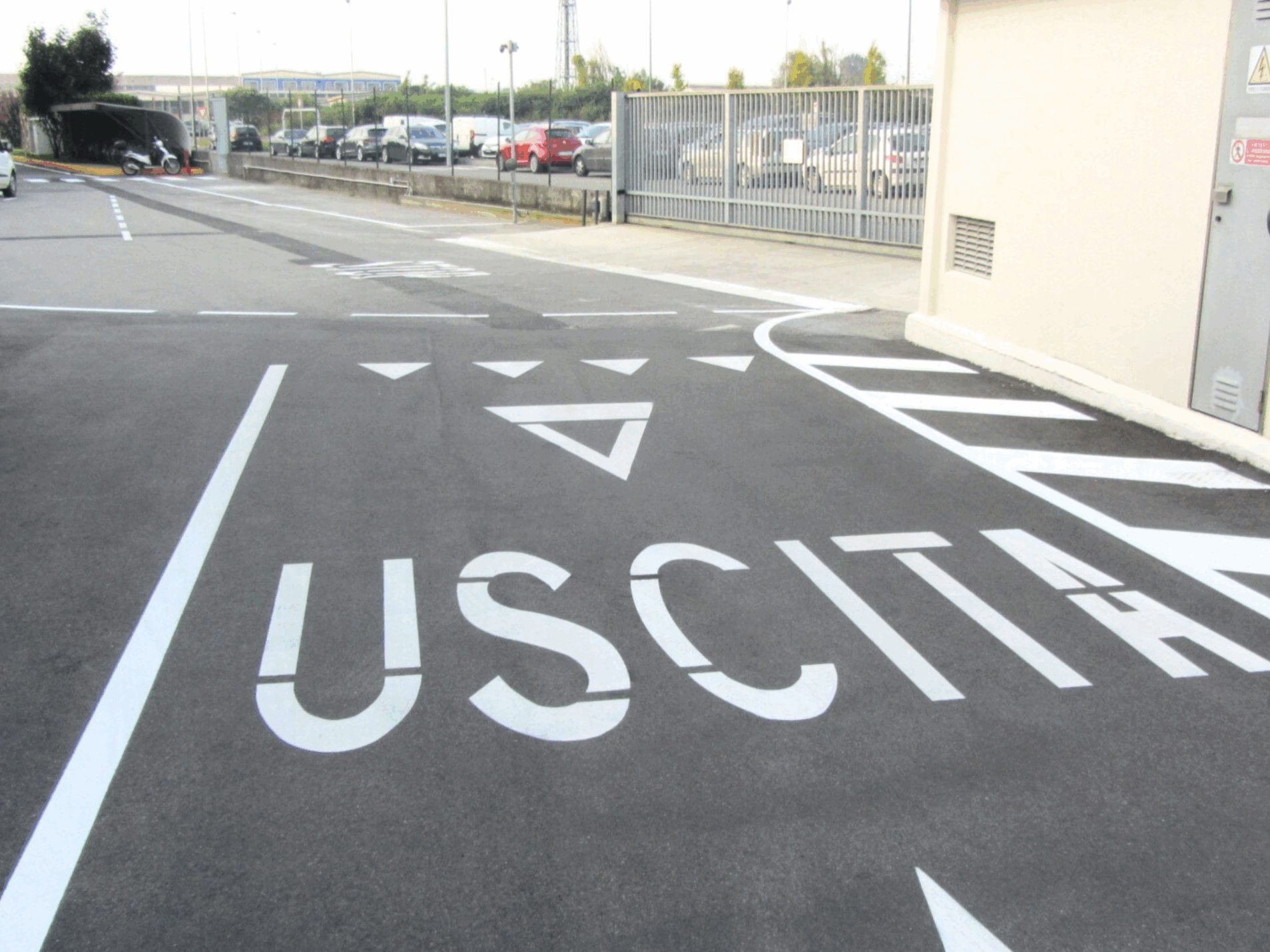 Prismo Vernisol solvent borne acrylic paint applied airless in white on a car park