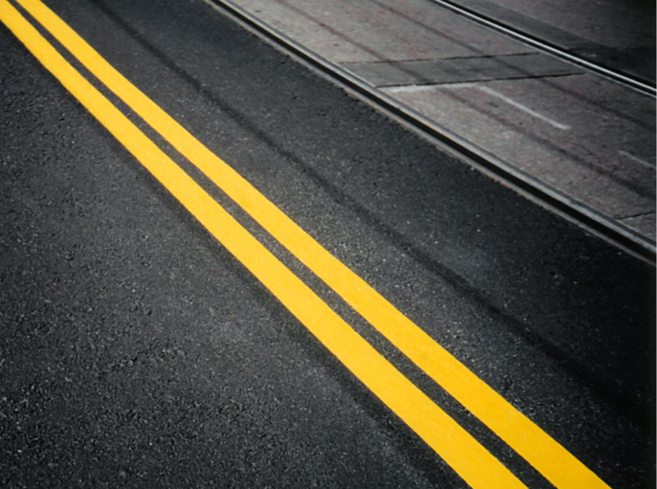 Prismo hot applied thermoplastic double yellow line marking on asphalt