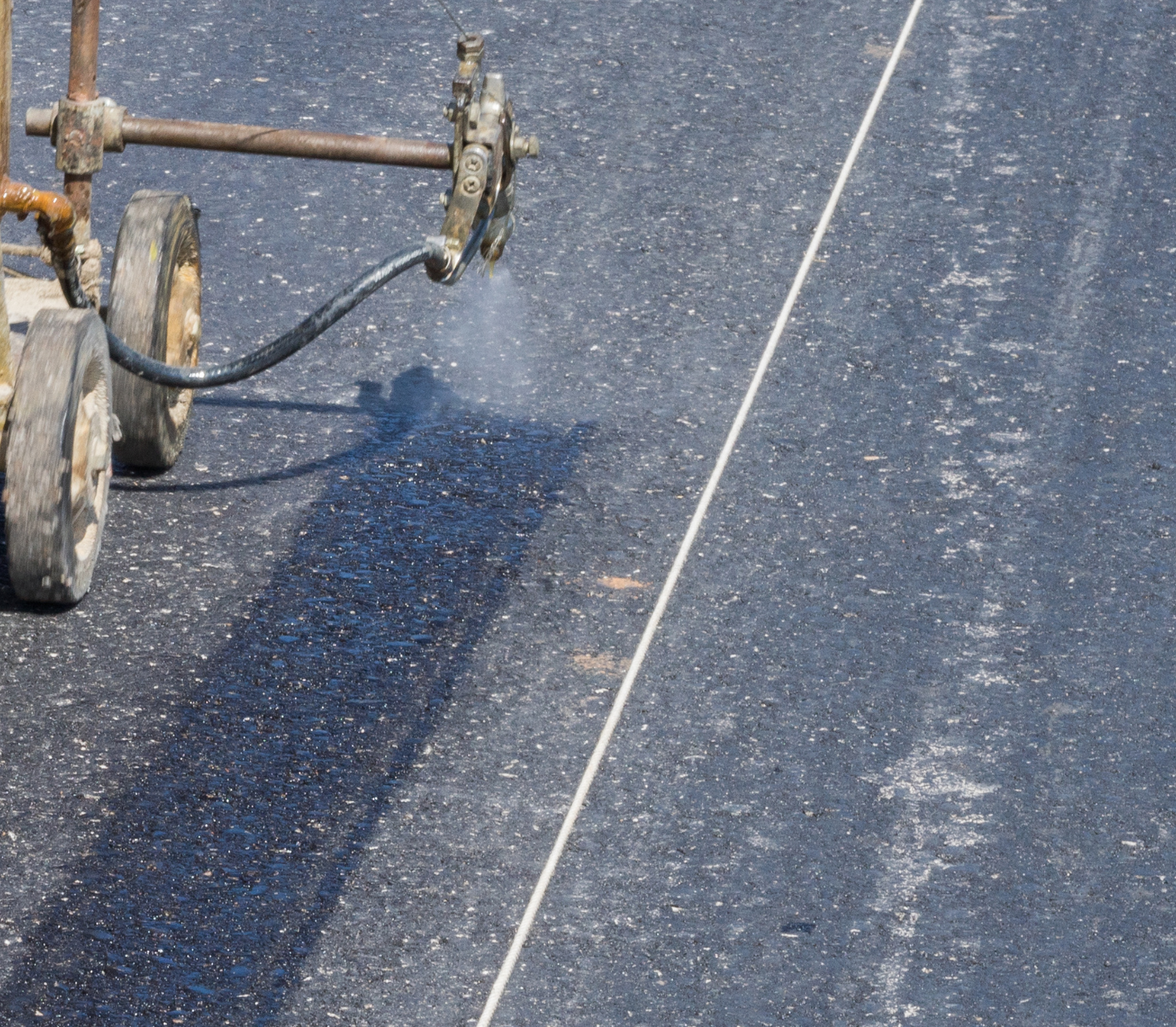 Universal Primer Sealer being applied using spray machinery for line markings