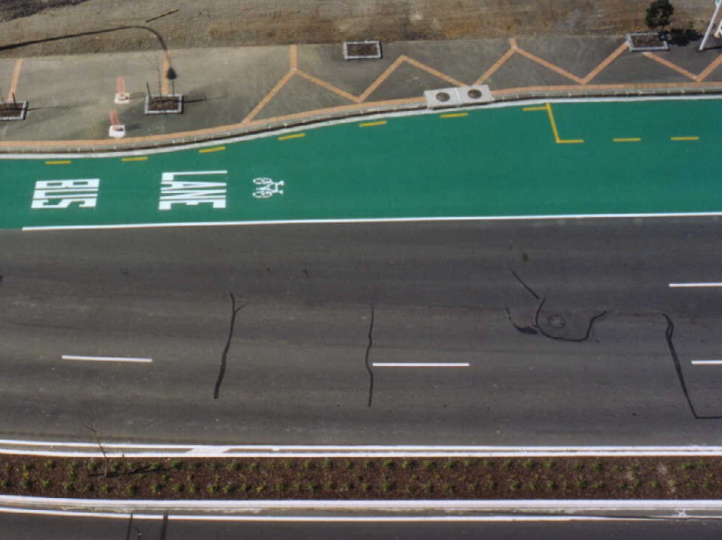 Overhead view of a Prismo Tyregrip green bus lane with high-friction surfacing in New Zealand