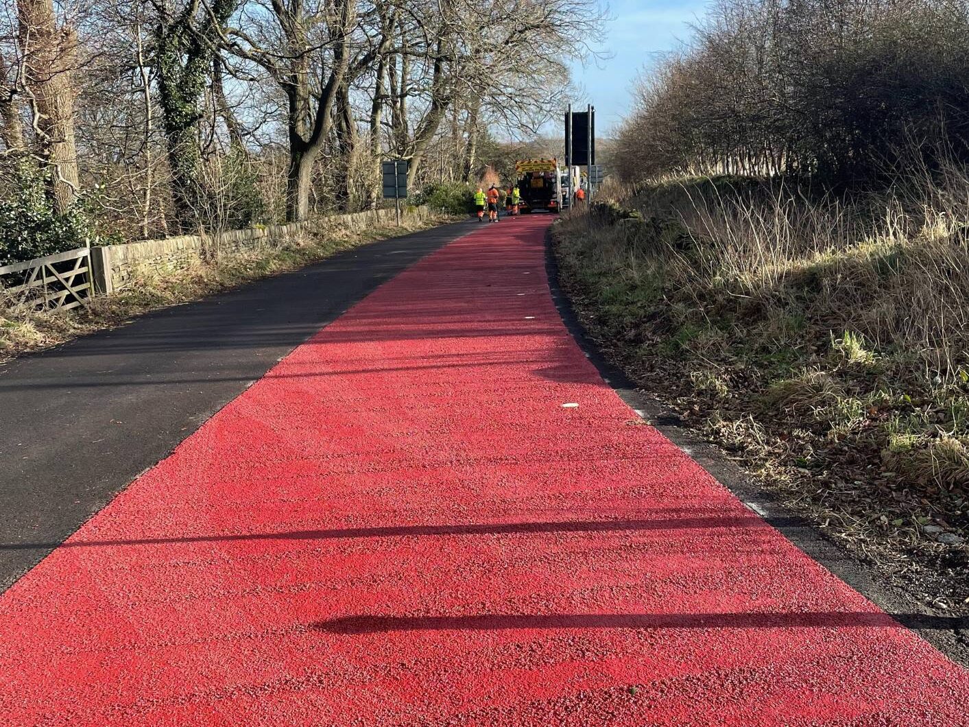 Red Zebraflex high friction surfacing applied on a country lane in Kirkburton