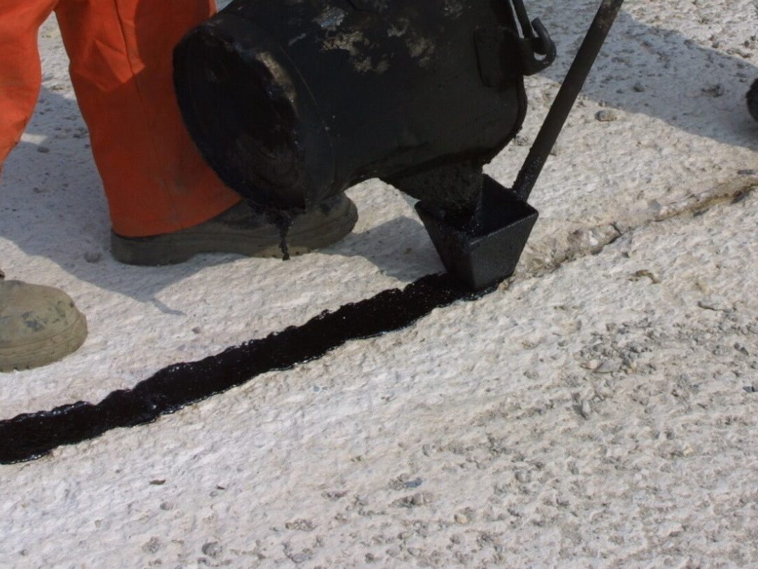 Prismo Prismoseal bitumen and hot melt product applied by hand