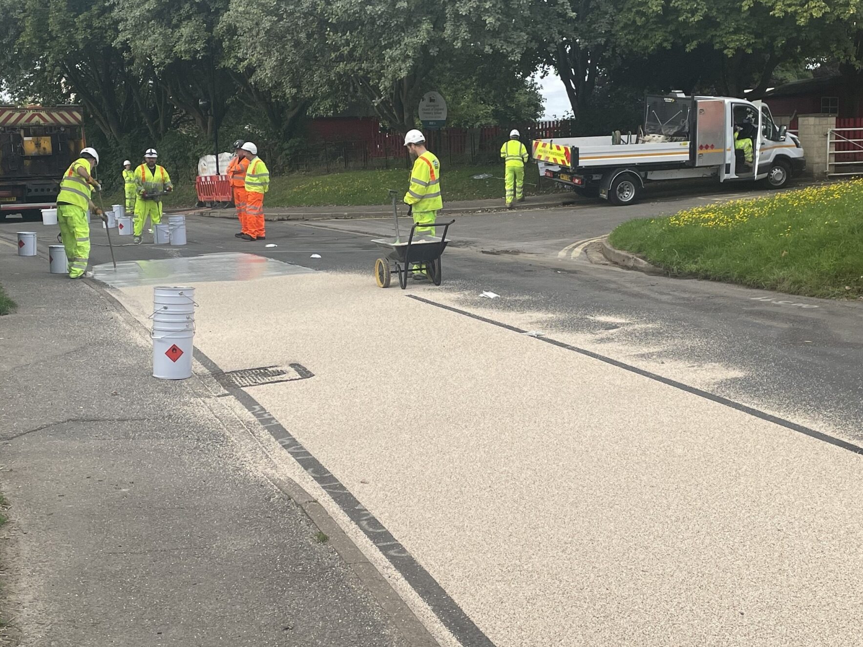 Several contractors working together to apply Prismogrip high friction surfacing