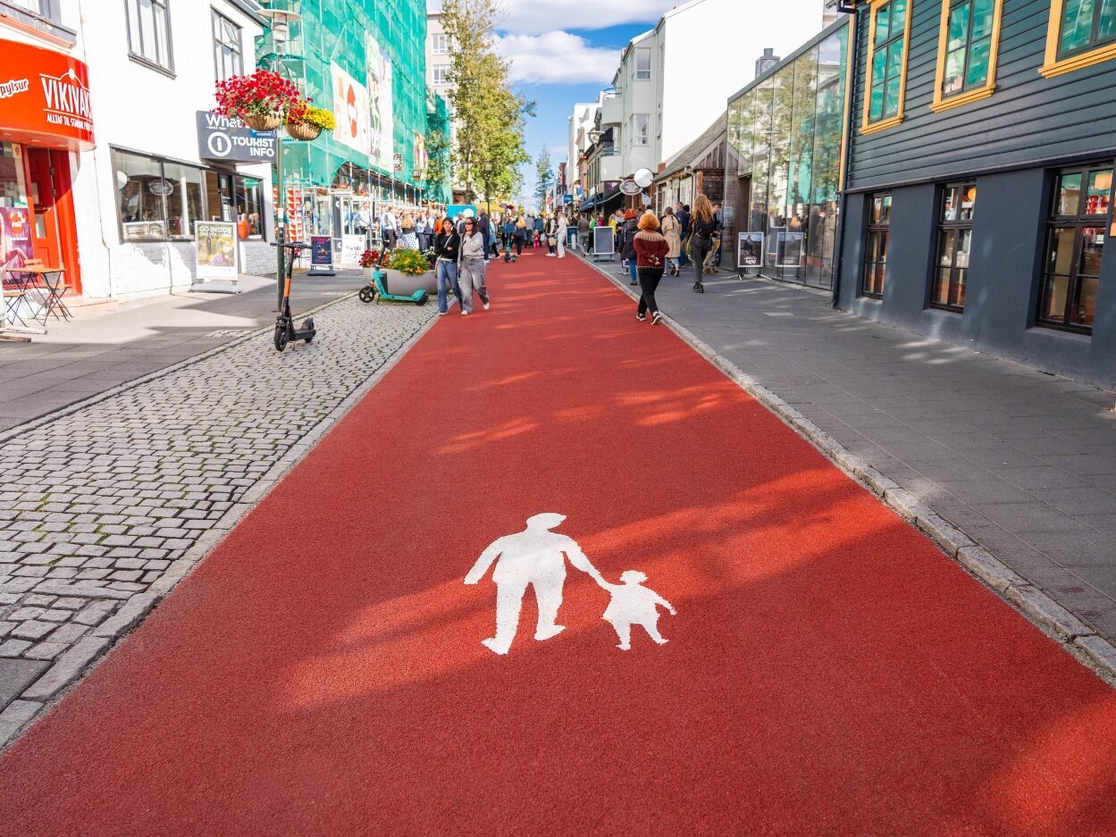 Pedestrians walking on Prismo Tyregrip high friction surfacing on an urban pedestrian pathway in Reykjavík, IcelandI WANT THE TITLE STRUCTURE TO BE THE